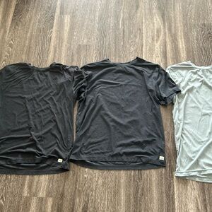 Three Vuori short sleeve performance tee